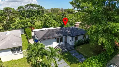 a red balloon is on top of a house at Casa Siesta- Hot tub Home Gym and Modern Design in Miami