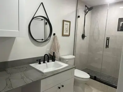 a bathroom with a toilet and a sink and a shower at Coastal Haven 5 Min to Beach, Patio, BBQ in Dania Beach