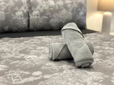 a teddy bear with socks on a bed at Doral Studio with Fabulous View in Miami