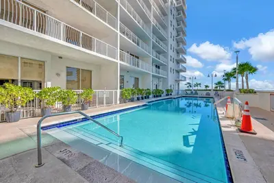 a swimming pool in an apartment complex with a building at 36th-Floor Ocean View Brickell - Free Parking in Miami