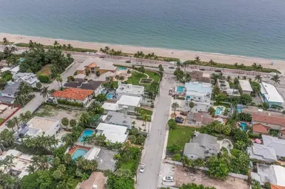 an aerial view of a house next to the beach at Beach Home Estate I Pool & Ocean in Fort Lauderdale