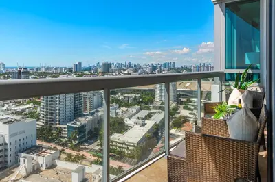 a view of a city from the balcony of a building at Oceanview Private Condo at The Setai -2604 in Miami Beach