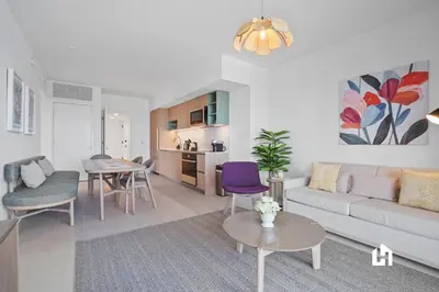 a living room with a couch and a table at Stylish Apartments with Partial Ocean Views in Downtown! in Miami