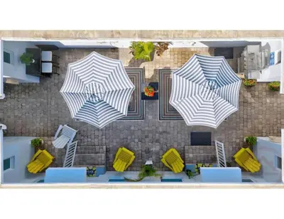 an overhead view of three umbrellas on a patio at Studio Oasis near Hollywood Boardwalk in Hollywood