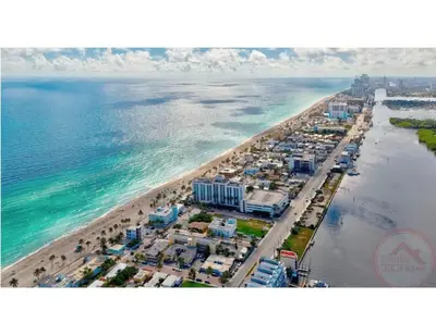 an aerial view of a beach and the ocean at Coastal Comfort Hollywood Studio Retreat in Hollywood