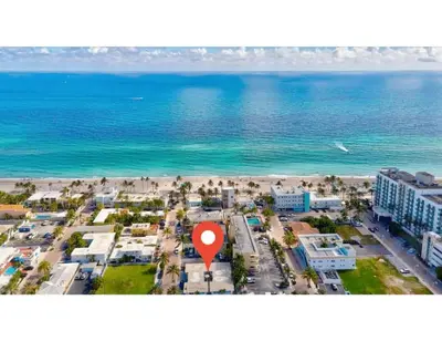 an aerial view of a beach with a red marker at Coastal Comfort Hollywood Studio Retreat in Hollywood