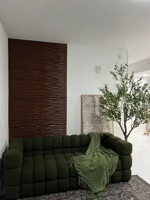 a green couch in a living room with a tree at MIAMI WOOD APART HOTEL NEW 2024 - PRIVATE TERRACE - free GARAGE - Beach 5 min in Hollywood