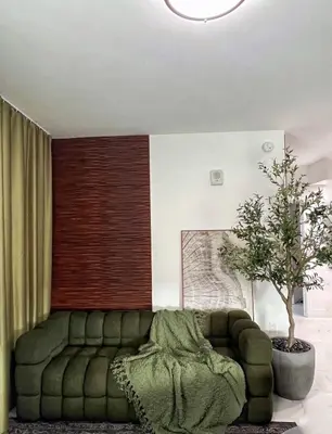 a living room with a green couch and a tree at MIAMI WOOD APART HOTEL NEW 2024 - PRIVATE TERRACE - free GARAGE - Beach 5 min in Hollywood