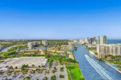 an aerial view of a city with a river at Penthouse Sky Suite - 2BDR2BTH - Private Rooftop Terrace in Hallandale Beach
