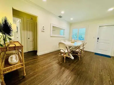 a dining room with a table and chairs at Gorgeous Las Olas - Heated Pool, Close to Beach in Fort Lauderdale