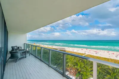 a balcony with a view of the beach at Oceanfront 3B Private Residence at South Beach - 828 in Miami Beach