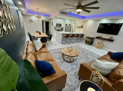 a living room with a couch and a table at 3Bd 2Bath 1 Block from the beach! Newly renovated in Fort Lauderdale
