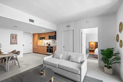 a living room with a couch and a table at New Luxury 26th Floor Apartment in the heart of Miami in Miami