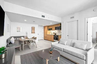 a living room with a couch and a table at New Luxury 26th Floor Apartment in the heart of Miami in Miami