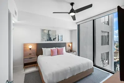 a bedroom with a bed and a ceiling fan at New Luxury 26th Floor Apartment in the heart of Miami in Miami