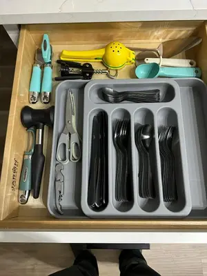 a drawer filled with utensils and other kitchen items at AQUAMARIA HOME - perfect stay for groups in Fort Lauderdale