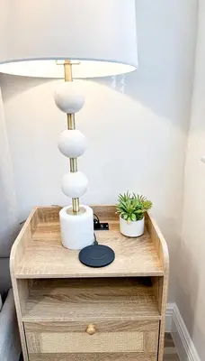 a table with a lamp on top of a nightstand at AQUAMARIA HOME - perfect stay for groups in Fort Lauderdale