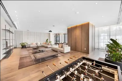 a large living room with a couch and a organ at Lux 2BR Natiivo Condo With Pool, Spa and Gym Access in Miami