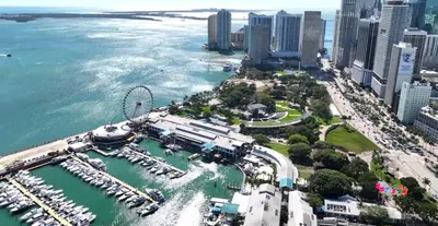 an aerial view of a city with a marina at 49th Floor Sleek Condo Cozy Pool, Gym and Spa Stay in Miami