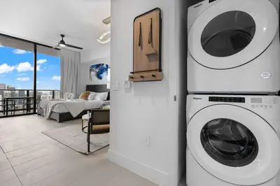 a living room with a washer and dryer in a house at PH 49 Floor Luxury Studio w Free Parking in Miami