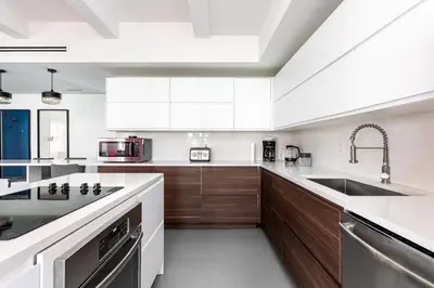 a kitchen with wooden cabinets and a sink at The Netherland 2A I Ocean Drive I MIAMI BEACH OCEAN RENTAL in Miami Beach