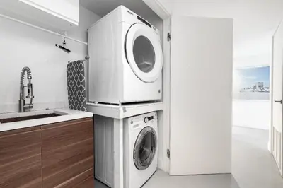 a washer and dryer in a kitchen with a sink at The Netherland 2A I Ocean Drive I MIAMI BEACH OCEAN RENTAL in Miami Beach