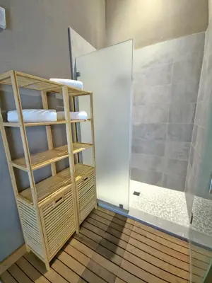 a bathroom with a shower and a glass door at Sleek New Brickell Condo With Free Parking - CS65 in Miami