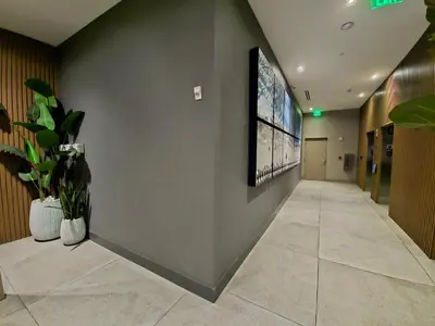 a hallway with a large screen on the wall at Sleek New Brickell Condo With Free Parking - CS65 in Miami