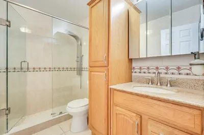 a bathroom with a toilet and a sink and a shower at Pet-Friendly Home with Yard about 3 Mi to Zoo Miami! in Cutler Ridge