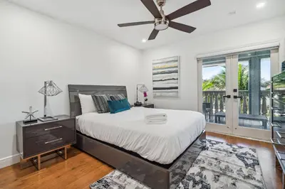 a bedroom with a bed and a ceiling fan at Tropical Pool Paradise x 6-BD 4-BA Luxury Living in Hialeah