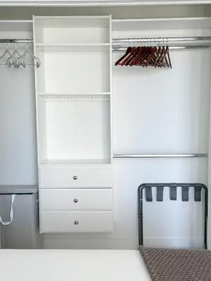 a white closet with white cabinets and a mirror at Private Terrace in Luxury 3BR Condo in Brickell in Miami