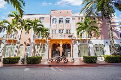 a group of bikes parked in front of a building at Casa Victoria Orchid Hotel in Miami Beach