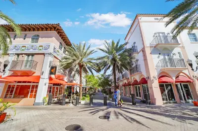 a street in a town with palm trees and buildings at Casa Victoria Orchid Hotel in Miami Beach