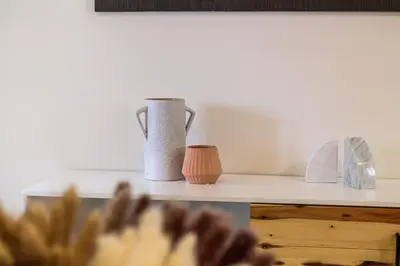 a kitchen counter with a pitcher and other items on it at Roami at The Palace in Miami