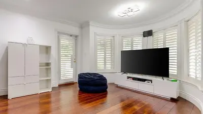 a large living room with a flat screen tv at 5mins to Beach • Pool Hot Tub • Billiards Coral Ridge Getaway by AvantStay in Fort Lauderdale