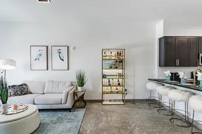 a living room with a couch and a table at Modern 2BR, Family-Friendly in FLL, Near Beach! in Fort Lauderdale