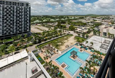 an aerial view of a pool at a hotel at Wonderful 1 bedroom Apartment in Downtown Doral in Miami