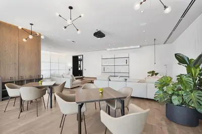 a living room with tables and chairs and a couch at Modern Apartment 2BR-2BTH- Pool & Gym in Miami