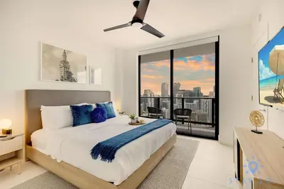 a bedroom with a large bed and a large window at Spectacular Apartment with Pool & Gym in Miami