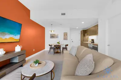 a living room with a couch and a table at Chic Downtown - City Views Gym & Pool in Miami