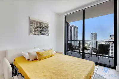 a bedroom with a bed and a large window at Oasis Apartment 1 Bedroom with Pool & Gym in Miami
