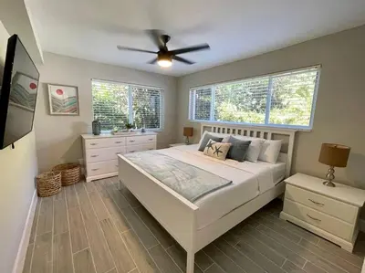 a bedroom with a bed and a ceiling fan at 2Bdrm 1Bath Newly Renovated Condo - Walk to the Beach! in Fort Lauderdale