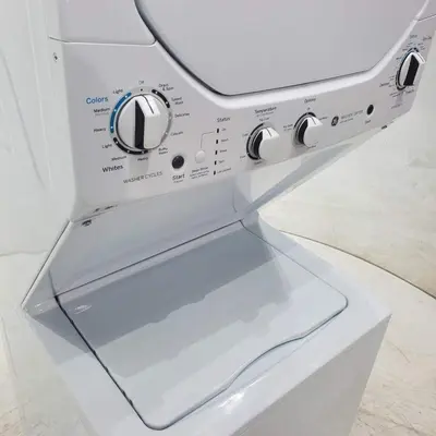 a close up of a washing machine with a drawer at Family Pet Friendly Apartment 3 Minute Walk to Miami Beach in Miami Beach