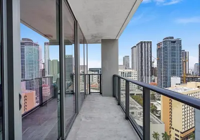 a balcony with a view of a city skyline at X Lounge II-Highline Corner Residence in Miami