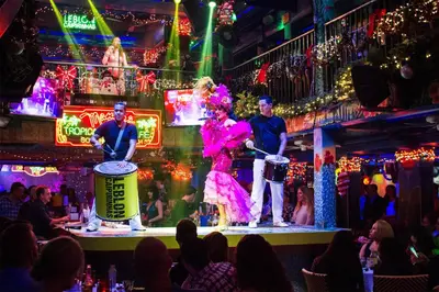a group of people on stage in a nightclub at Ocean Drive South Beach Miami in Miami Beach