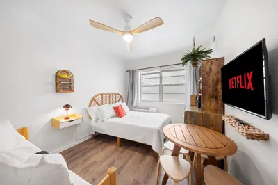 a small living room with a couch and a table at Ocean Drive Steps to Sea in South Beach with Free Parking in Miami Beach