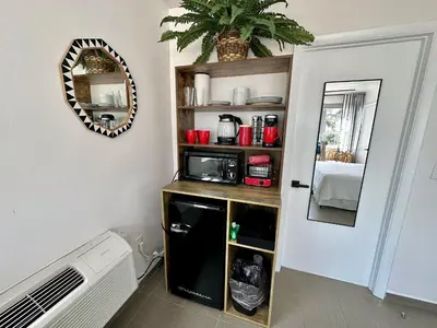 a laundry room with a counter and a microwave at Ocean Drive Oasis Beach Views South Beach Miami in Miami Beach