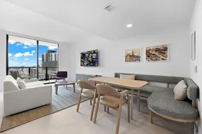 a living room with a table and chairs at Free Parking! Luxury Condo in Downtown Miami in Miami