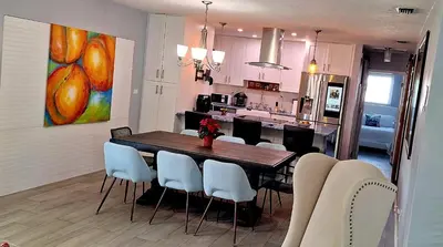 a kitchen and dining room with a table and chairs at Holliday 3-bedroom Private duplex House Parking WiFi BBQ Karaoke Available in Cutler Bay