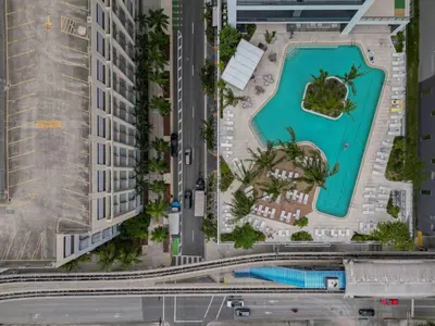 an aerial view of a resort with a swimming pool at Bayside Breeze - Downtown Luxury Tower in Miami